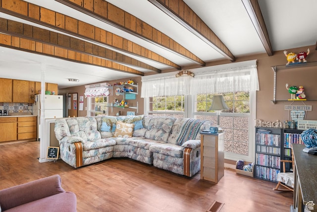 3058 S Edgemont Dr Unit 253, 54, Garden City, UT 84028 - living room with plenty of natural light, beam ceiling, and light wood-style flooring