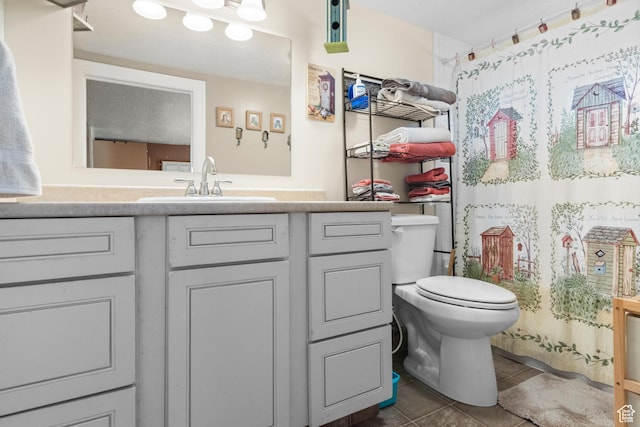 3058 S Edgemont Dr Unit 253, 54, Garden City, UT 84028 - bathroom featuring tile patterned flooring, vanity, toilet, and a shower with shower curtain