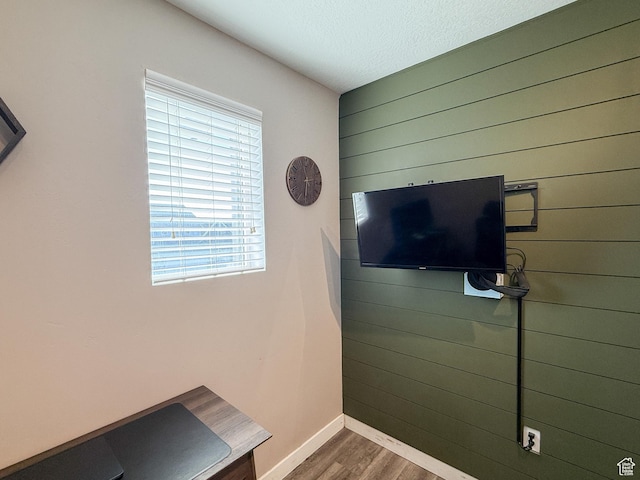 3508 S Creek Side Ln, Syracuse, UT 84075 - detailed view of wooden walls, wood finished floors, baseboards, and a textured ceiling