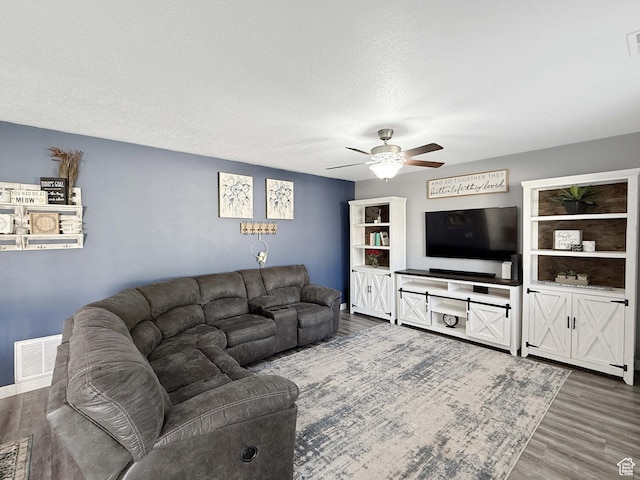 3508 S Creek Side Ln, Syracuse, UT 84075 - living area featuring ceiling fan, wood finished floors, a textured ceiling, and baseboards