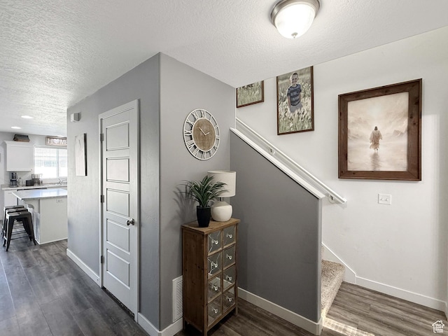 3508 S Creek Side Ln, Syracuse, UT 84075 - stairs with a textured ceiling, wood finished floors, and baseboards