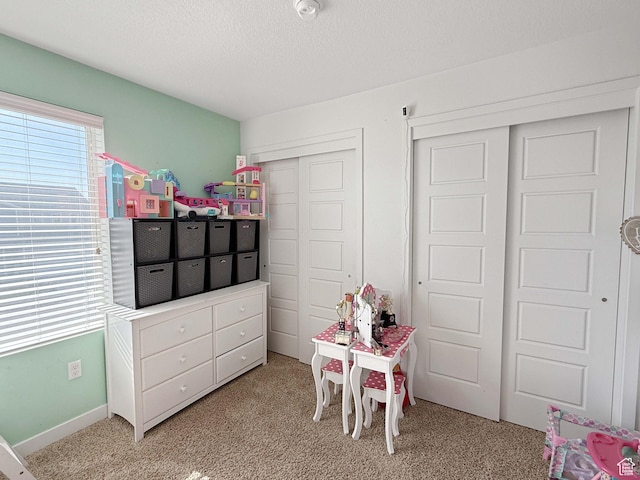 3508 S Creek Side Ln, Syracuse, UT 84075 - rec room featuring light carpet and a textured ceiling