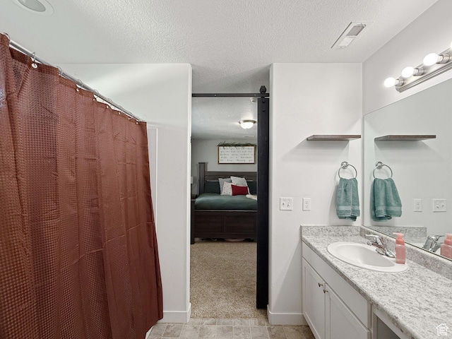 3508 S Creek Side Ln, Syracuse, UT 84075 - bathroom featuring ensuite bath, a textured ceiling, vanity, and curtained shower