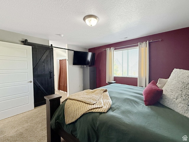 3508 S Creek Side Ln, Syracuse, UT 84075 - bedroom featuring carpet floors, a barn door, and a textured ceiling