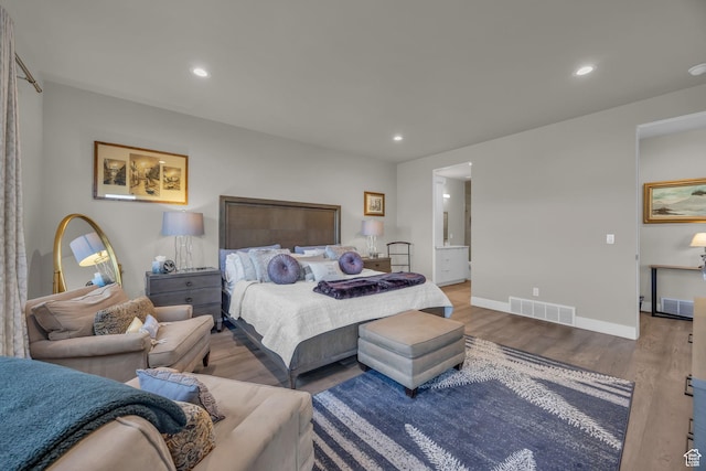 9984 N Rail Loop Unit 29, Heber City, UT 84032 - bedroom featuring wood finished floors, recessed lighting, baseboards, and ensuite bathroom
