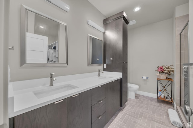 9984 N Rail Loop Unit 29, Heber City, UT 84032 - bathroom with baseboards, double vanity, a shower, brick patterned floors, and toilet