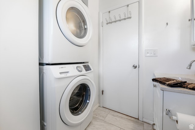 180 W Vine St, Tooele, UT 84074 - laundry room with stacked washer / dryer, light marble finish flooring, and a sink