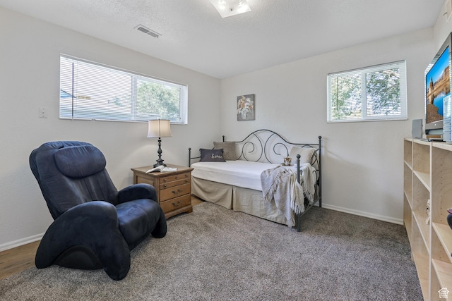 180 W Vine St, Tooele, UT 84074 - bedroom with multiple windows and baseboards