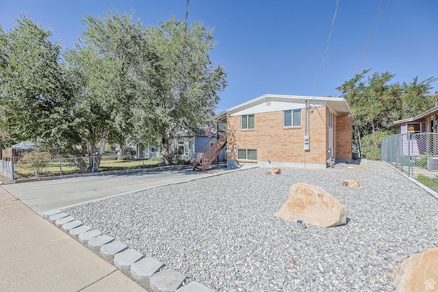 180 W Vine St, Tooele, UT 84074 - view of front facade with brick siding and stairway