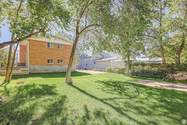 180 W Vine St, Tooele, UT 84074 - view of yard featuring a patio area