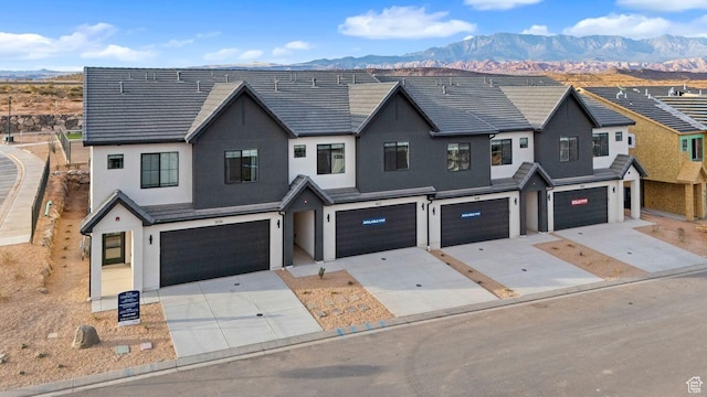 1675 S Ripple Rock Dr Unit 3010, Washington, UT 84780 - multi unit property featuring a garage, stucco siding, and a mountain view
