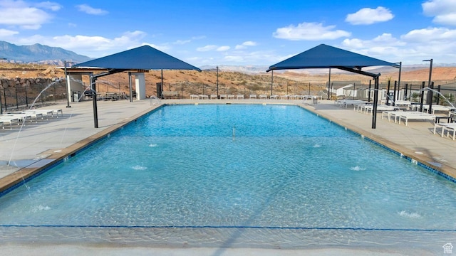 1675 S Ripple Rock Dr Unit 3010, Washington, UT 84780 - community pool with a patio area and a mountain view