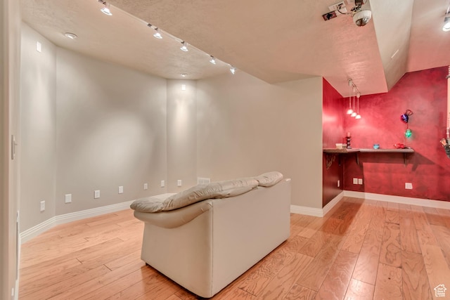 2116 E Falcon Ridge Dr, Draper Ut Cnty, UT 84020 - living area featuring light wood finished floors, baseboards, and track lighting