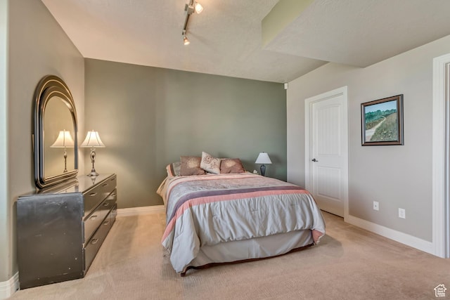2116 E Falcon Ridge Dr, Draper Ut Cnty, UT 84020 - bedroom with light colored carpet, baseboards, and track lighting