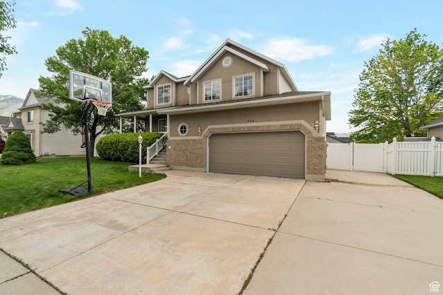 494 E High Berry Ln S, Draper, UT 84020 - traditional-style home with a gate, stucco siding, a garage, concrete driveway, and brick siding