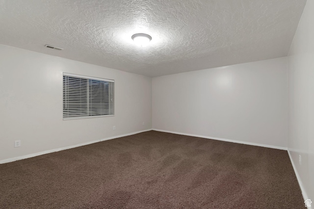 494 E High Berry Ln S, Draper, UT 84020 - empty room with a textured ceiling, dark carpet, and baseboards