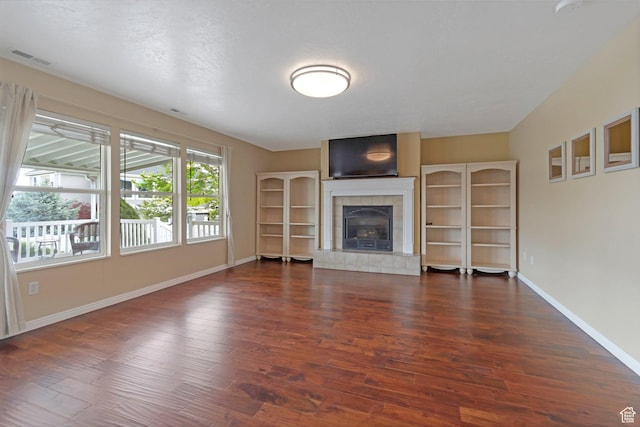 494 E High Berry Ln S, Draper, UT 84020 - unfurnished living room with baseboards, wood finished floors, and a fireplace