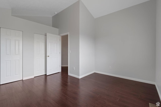 494 E High Berry Ln S, Draper, UT 84020 - unfurnished bedroom featuring vaulted ceiling, baseboards, wood finished floors, and multiple closets