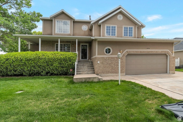 494 E High Berry Ln S, Draper, UT 84020 - view of front of home featuring stucco siding, a front lawn, concrete driveway, and brick siding