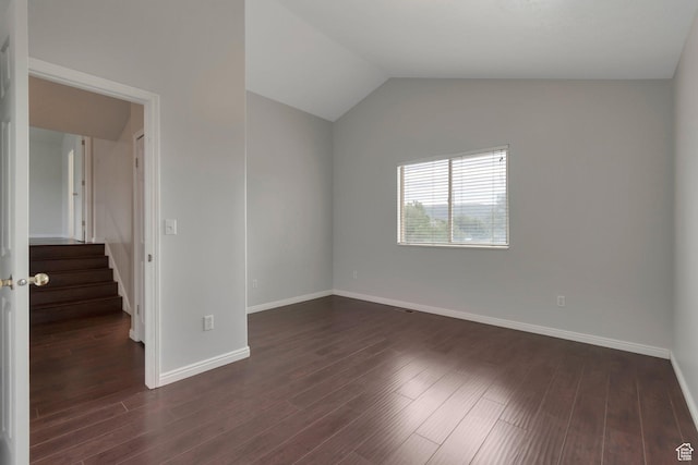494 E High Berry Ln S, Draper, UT 84020 - empty room featuring baseboards, dark wood-style floors, stairway, and vaulted ceiling