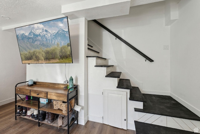 1404 N Lancelot Dr W, Provo, UT 84601 - staircase featuring wood finished floors, baseboards, and a textured ceiling