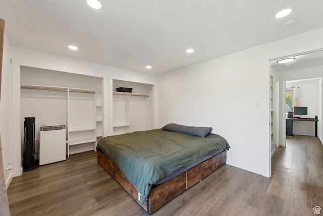 1404 N Lancelot Dr W, Provo, UT 84601 - bedroom featuring wood finished floors, recessed lighting, multiple closets, and baseboards