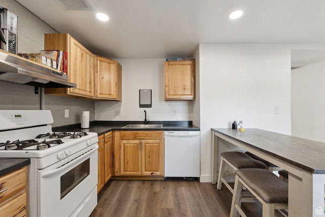 1404 N Lancelot Dr W, Provo, UT 84601 - kitchen featuring white appliances, a sink, dark countertops, dark wood-style flooring, and recessed lighting