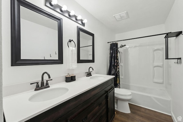 1404 N Lancelot Dr W, Provo, UT 84601 - full bathroom with toilet, wood finished floors, double vanity, and shower / tub combo