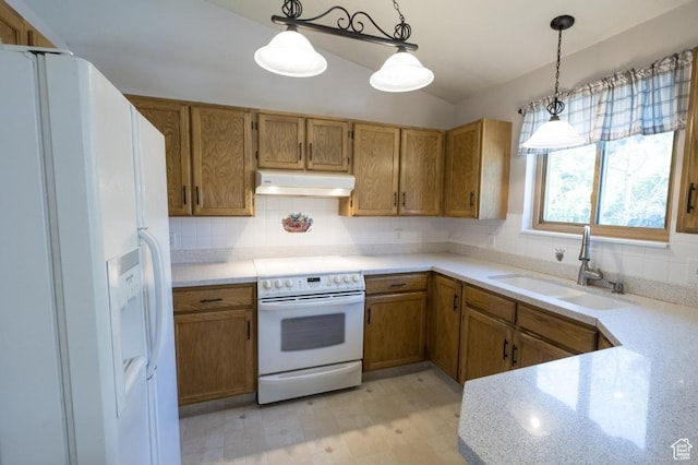 30 E 200 N, Millville, UT 84326 - kitchen featuring white appliances, a sink, under cabinet range hood, brown cabinetry, and tasteful backsplash