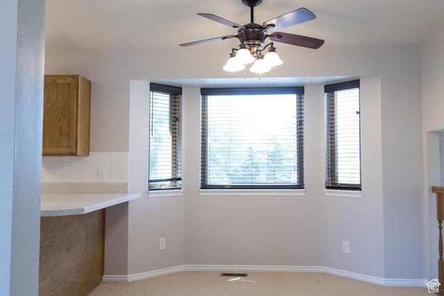 30 E 200 N, Millville, UT 84326 - unfurnished dining area featuring ceiling fan, baseboards, and light carpet