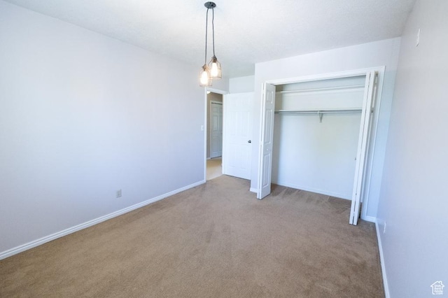 30 E 200 N, Millville, UT 84326 - unfurnished bedroom featuring carpet floors, a closet, and baseboards