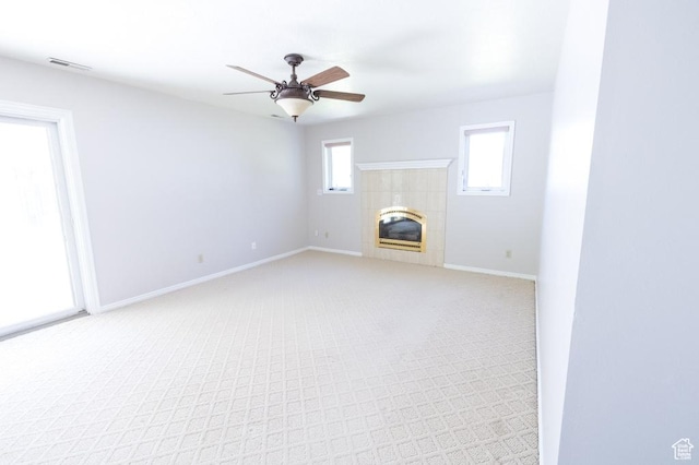 30 E 200 N, Millville, UT 84326 - unfurnished living room featuring light carpet, ceiling fan, baseboards, and a tile fireplace