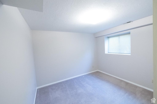 30 E 200 N, Millville, UT 84326 - spare room with a textured ceiling, carpet flooring, and baseboards