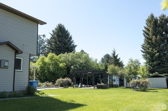 30 E 200 N, Millville, UT 84326 - view of grassy yard with a pergola