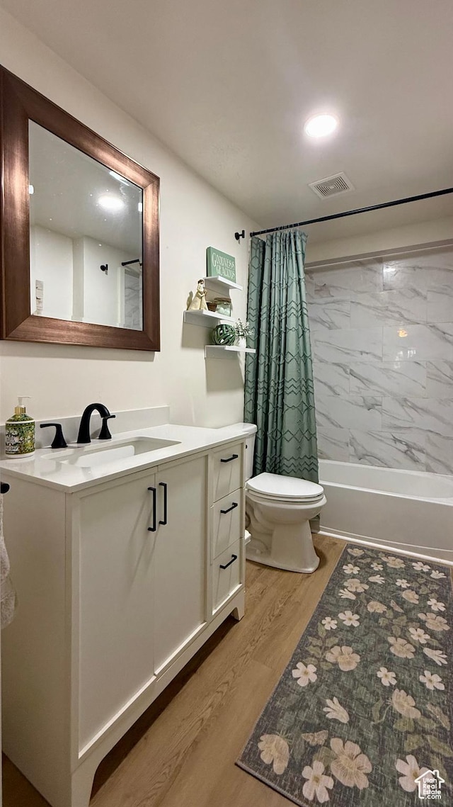 1273 W 1500 S, Vernal, UT 84078 - bathroom featuring wood finished floors, vanity, toilet, and shower / tub combo