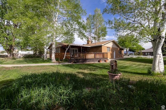 1273 W 1500 S, Vernal, UT 84078 - view of property exterior with a deck, a chimney, and brick siding