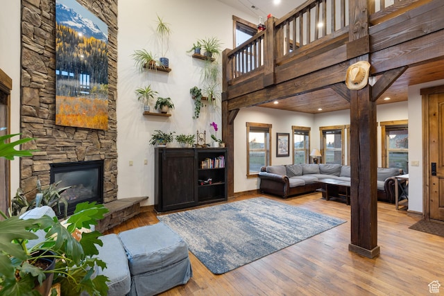 300 E 400 S, Kamas, UT 84036 - living area with a towering ceiling, a fireplace, wood finished floors, baseboards, and recessed lighting