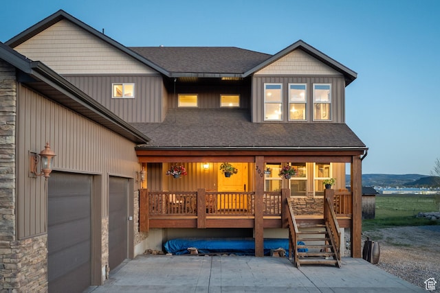 300 E 400 S, Kamas, UT 84036 - view of front of property featuring covered porch, roof with shingles, a garage, and driveway