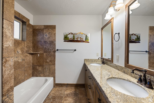 300 E 400 S, Kamas, UT 84036 - bathroom featuring baseboards, double vanity, a textured ceiling, shower / bath combination, and stone finish floors