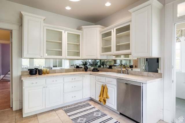 216 B St, Salt Lake City, UT 84103 - kitchen featuring stainless steel dishwasher, a sink, light countertops, white cabinetry, and recessed lighting