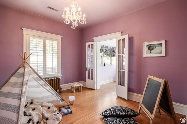 216 B St, Salt Lake City, UT 84103 - foyer with a chandelier, baseboards, and light wood-type flooring