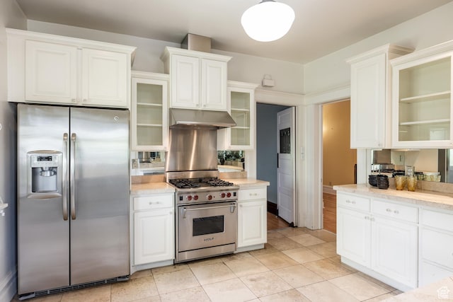 216 B St, Salt Lake City, UT 84103 - kitchen featuring appliances with stainless steel finishes, under cabinet range hood, white cabinetry, and glass insert cabinets