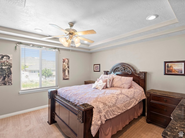 8552 S Maul Oak Dr, West Jordan, UT 84081 - bedroom featuring a textured ceiling, a tray ceiling, light carpet, baseboards, and ceiling fan