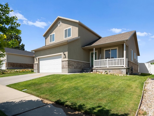 8552 S Maul Oak Dr, West Jordan, UT 84081 - view of front of home featuring covered porch, an attached garage, concrete driveway, stucco siding, and brick siding