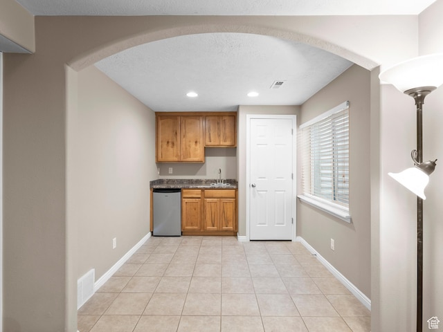 8552 S Maul Oak Dr, West Jordan, UT 84081 - kitchen with dishwashing machine, arched walkways, recessed lighting, a sink, and light tile patterned floors