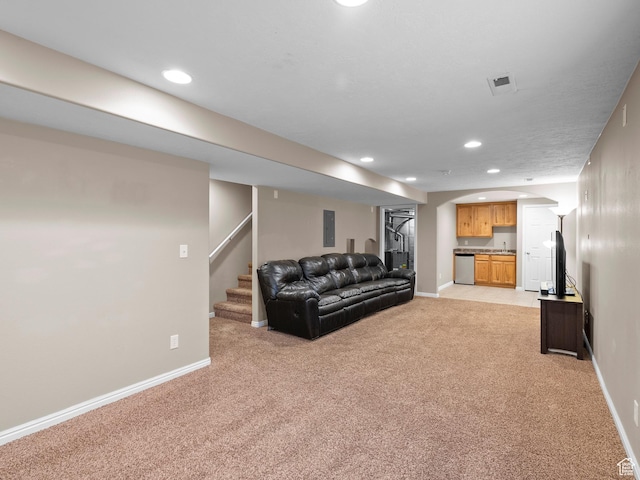 8552 S Maul Oak Dr, West Jordan, UT 84081 - living area with light colored carpet, recessed lighting, baseboards, arched walkways, and stairway