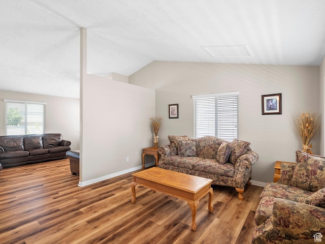 8552 S Maul Oak Dr, West Jordan, UT 84081 - living area featuring light wood-style floors, vaulted ceiling, baseboards, and attic access