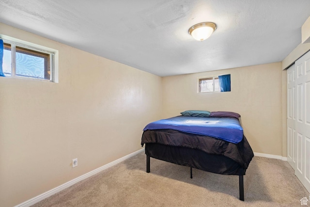 293 E 600 N, Tooele, UT 84074 - bedroom with carpet floors, baseboards, and a closet