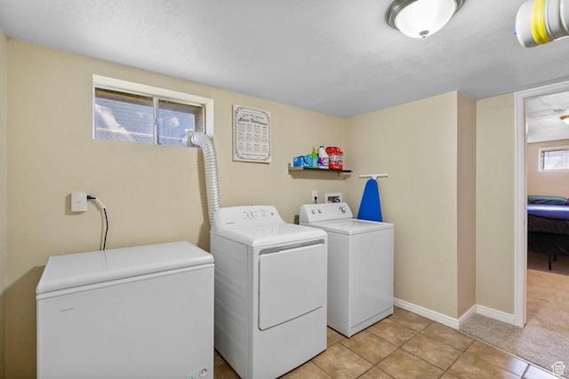 293 E 600 N, Tooele, UT 84074 - laundry room featuring independent washer and dryer, light tile patterned flooring, a textured ceiling, and baseboards