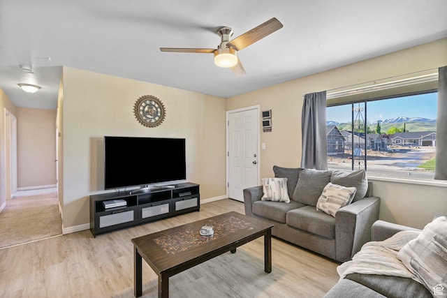 293 E 600 N, Tooele, UT 84074 - living room featuring a ceiling fan, light wood finished floors, and baseboards